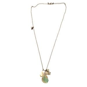 Long gemstone and charms necklace